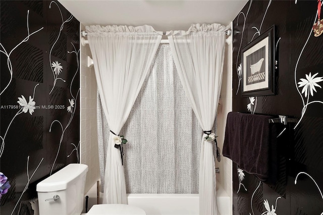 full bathroom featuring toilet and shower / bath combination with curtain
