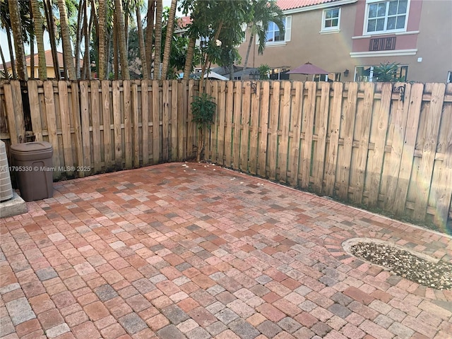 view of patio / terrace featuring fence
