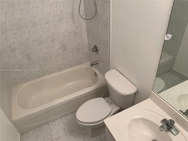 full bathroom featuring toilet, bathing tub / shower combination, and vanity