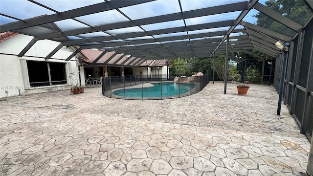 pool featuring a lanai and a patio