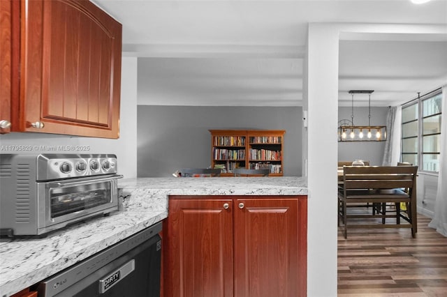 kitchen with dishwashing machine, an inviting chandelier, a toaster, and dark wood-style floors