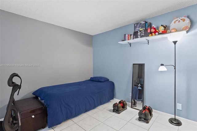 bedroom featuring light tile patterned floors