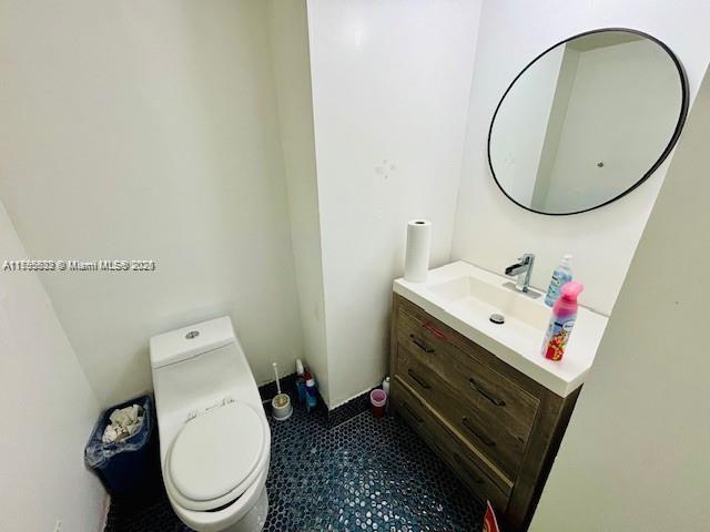 2780 NE 183rd St Unit 810, Aventura, FL 33160 - half bathroom with vanity and toilet