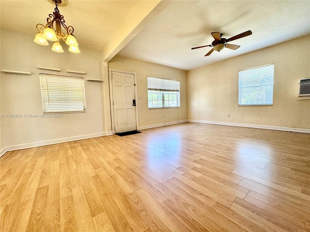 2100 NE 173rd St, North Miami Beach, FL 33162 - unfurnished room with baseboards, ceiling fan with notable chandelier, and wood finished floors
