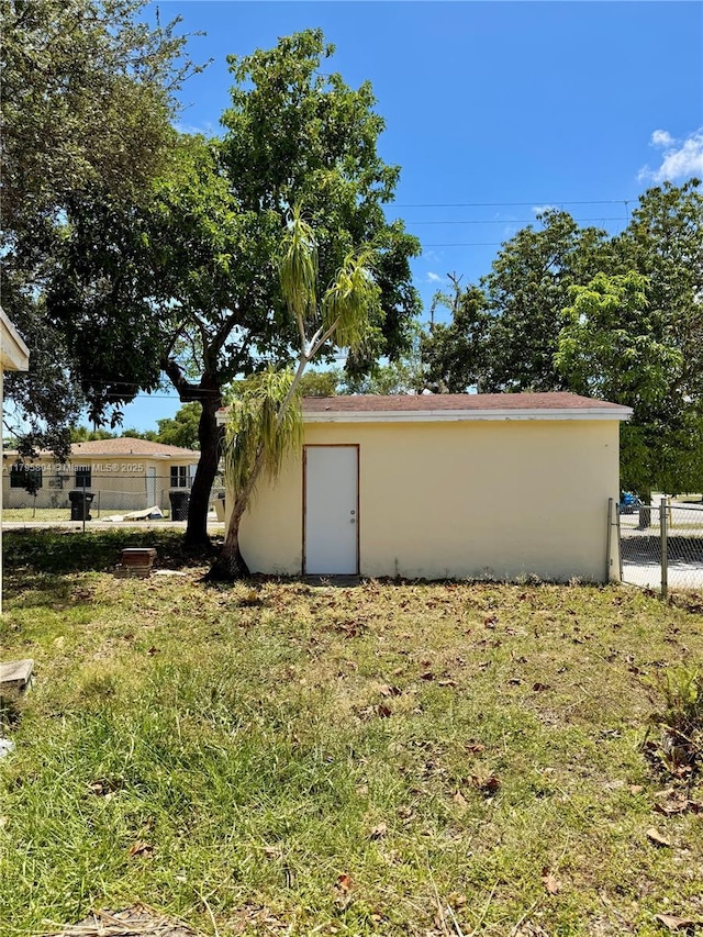 2100 NE 173rd St, North Miami Beach, FL 33162 - view of outbuilding with fence and an outdoor structure