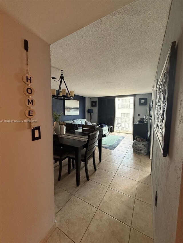 401 Ocean Dr Unit 324, Miami Beach, FL 33139 - dining room with a textured ceiling and light tile patterned floors