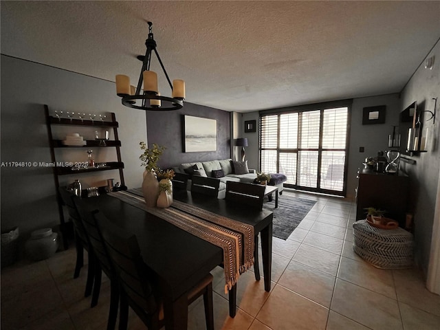 401 Ocean Dr Unit 324, Miami Beach, FL 33139 - tiled dining room with a chandelier and a textured ceiling