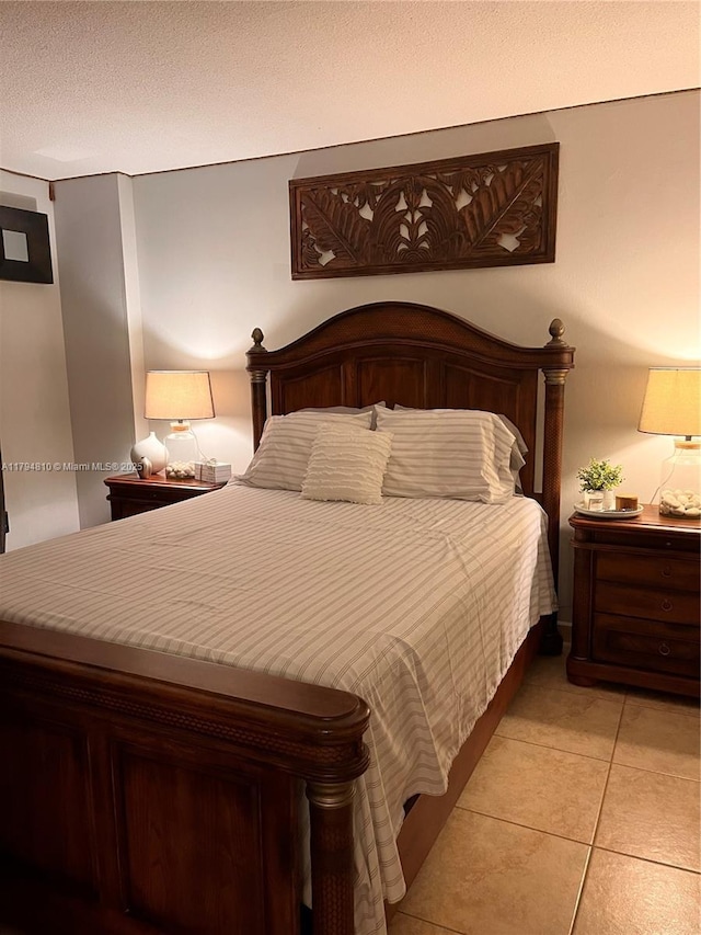 401 Ocean Dr Unit 324, Miami Beach, FL 33139 - bedroom with light tile patterned floors
