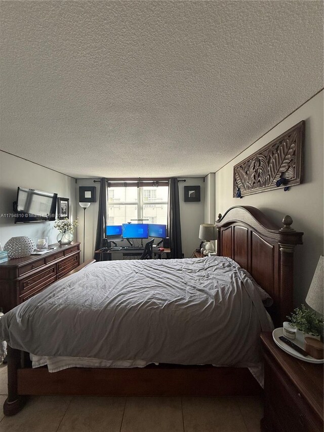 401 Ocean Dr Unit 324, Miami Beach, FL 33139 - tiled bedroom featuring a textured ceiling