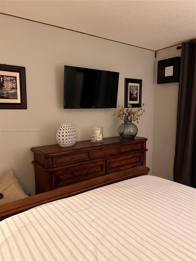 401 Ocean Dr Unit 324, Miami Beach, FL 33139 - bedroom with a textured ceiling