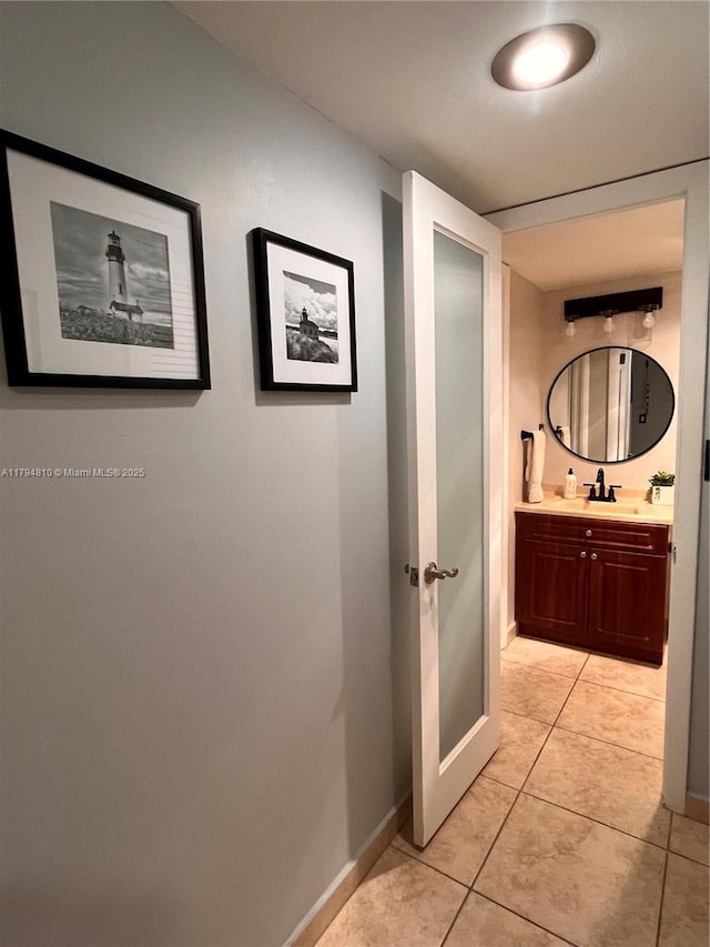 401 Ocean Dr Unit 324, Miami Beach, FL 33139 - bathroom with vanity and tile patterned flooring