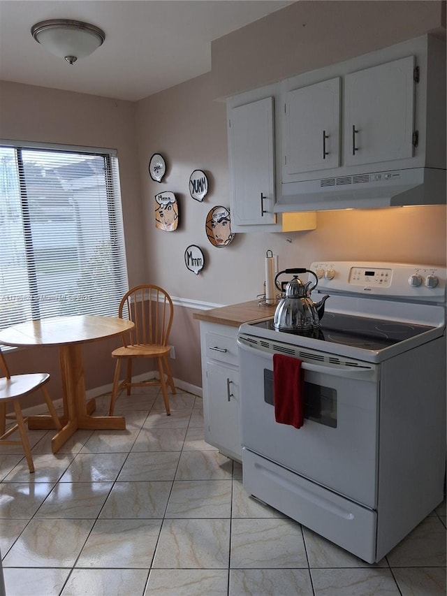 kitchen featuring light countertops, electric stove, white cabinetry, baseboards, and under cabinet range hood
