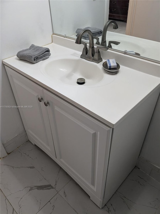 bathroom featuring vanity and marble finish floor