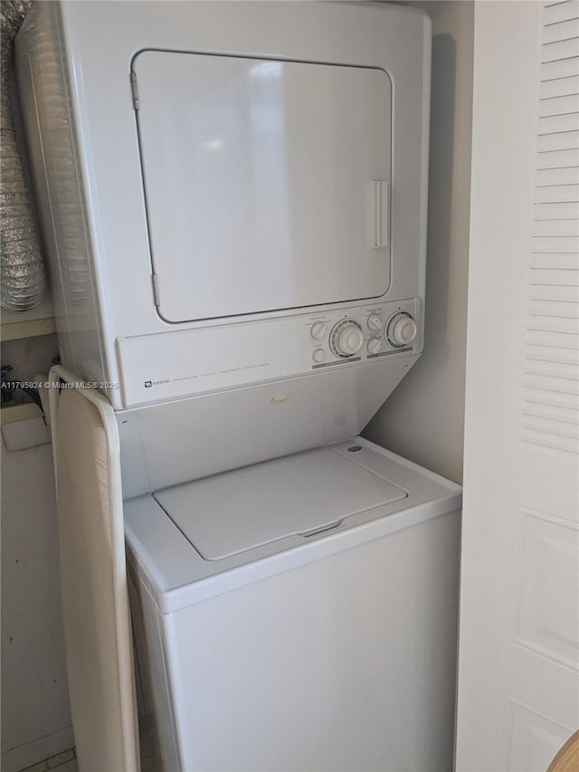 laundry area with stacked washer / drying machine