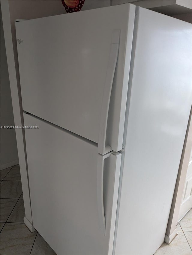 room details featuring freestanding refrigerator