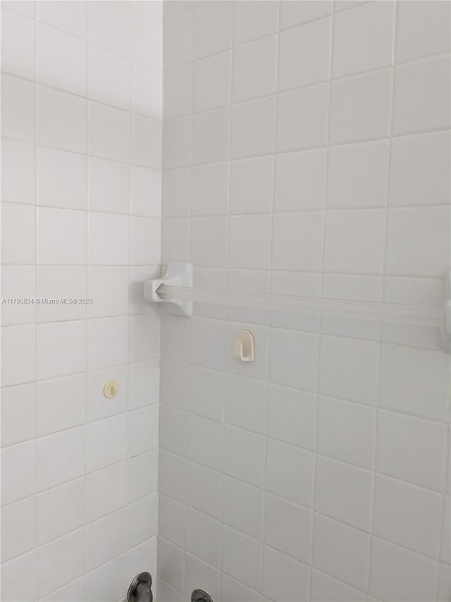 bathroom with a tile shower