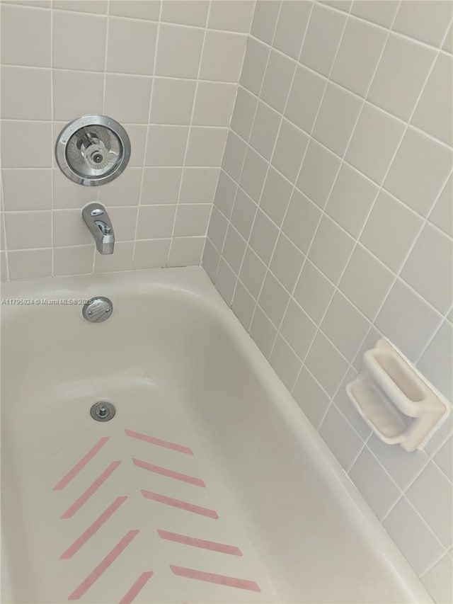 bathroom with a washtub