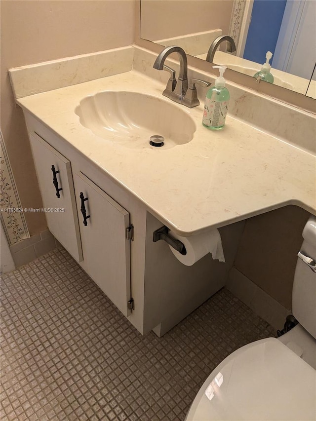 bathroom featuring toilet and vanity