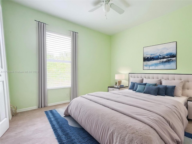 2857 Brewster St, North Port, FL 34288 - bedroom featuring light carpet, baseboards, and a ceiling fan