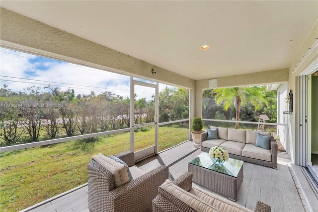 2857 Brewster St, North Port, FL 34288 - sunroom with an outdoor hangout area
