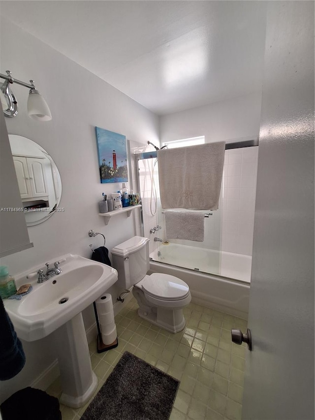 full bath featuring tile patterned flooring, shower / bathtub combination, and toilet