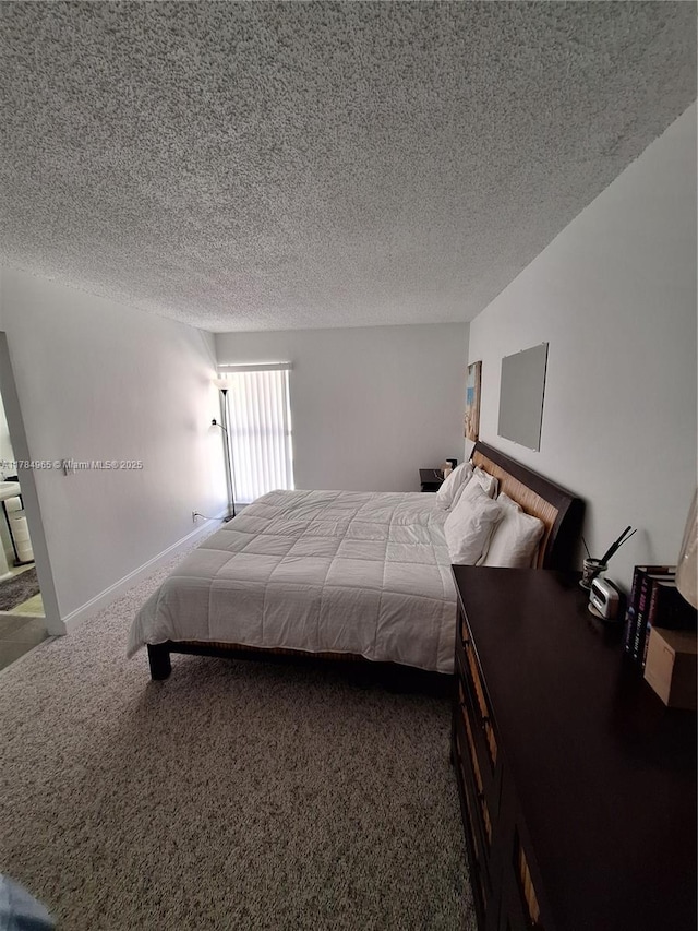 carpeted bedroom with a textured ceiling
