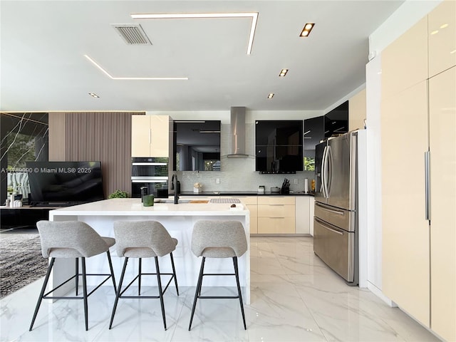 kitchen with wall chimney range hood, stainless steel fridge with ice dispenser, modern cabinets, and marble finish floor