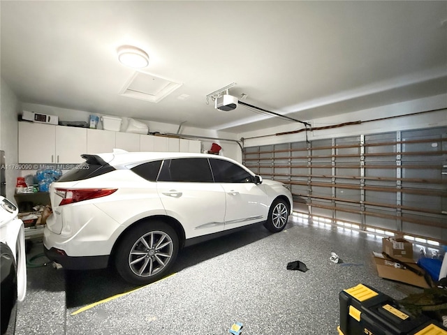 garage featuring a garage door opener