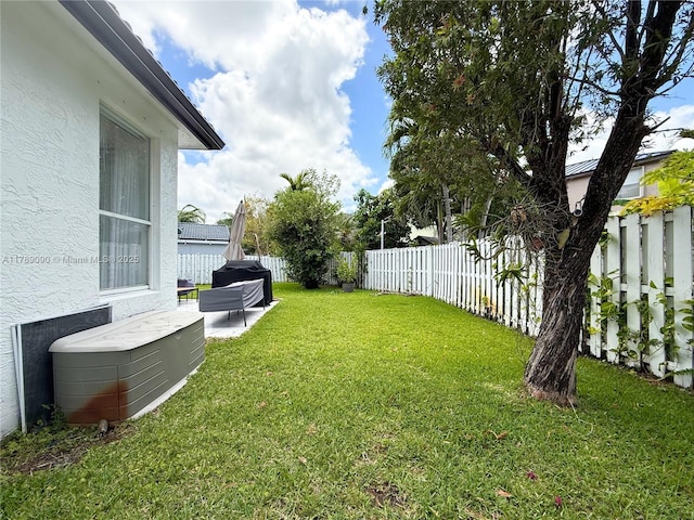 view of yard with a fenced backyard and a patio area