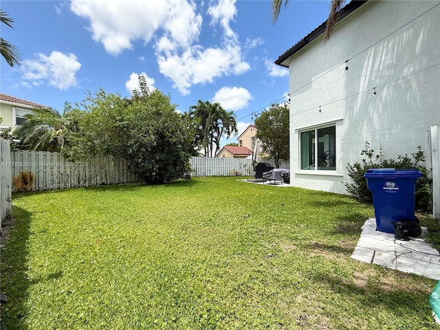 view of yard with a fenced backyard and a patio area