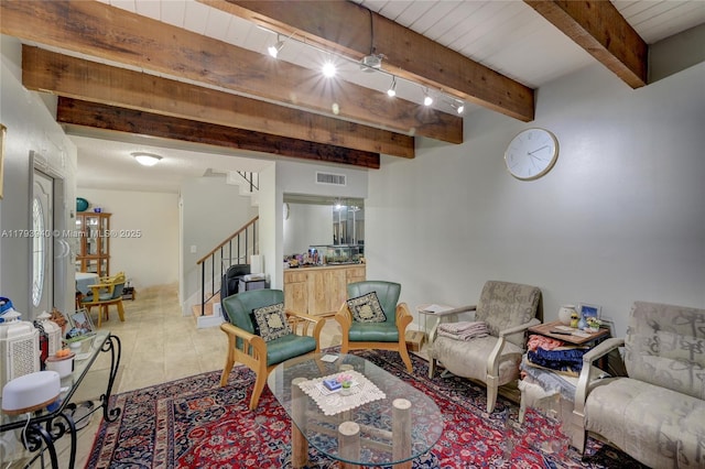 12079 W Regal Ct W, Wellington, FL 33414 - living area with stairway, beamed ceiling, and tile patterned floors
