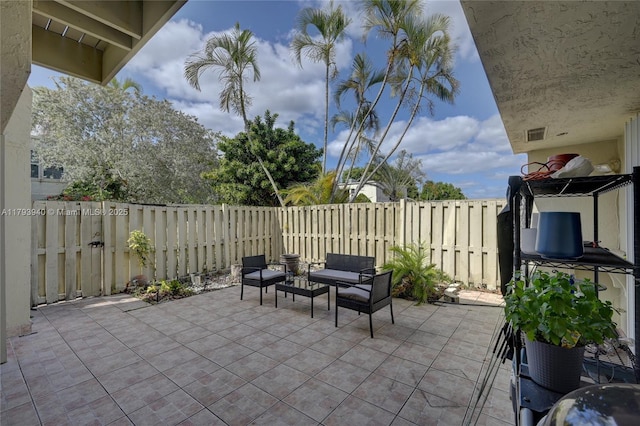 12079 W Regal Ct W, Wellington, FL 33414 - view of patio with a fenced backyard