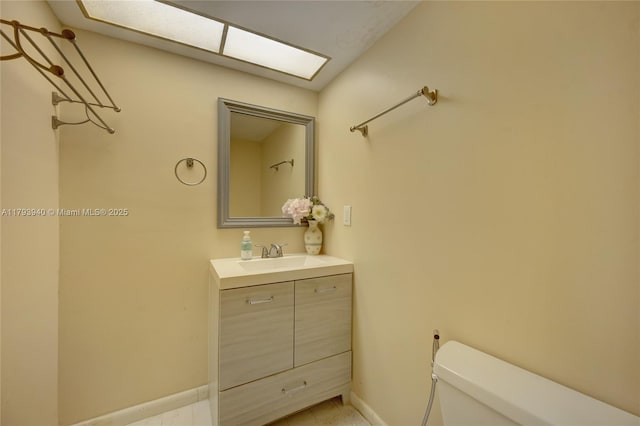 12079 W Regal Ct W, Wellington, FL 33414 - bathroom featuring toilet, vanity, and baseboards