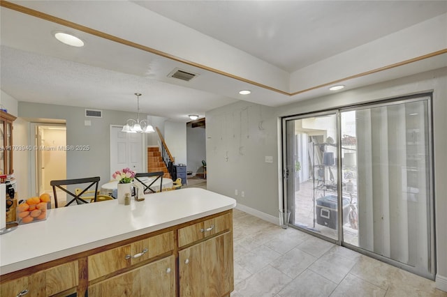12079 W Regal Ct W, Wellington, FL 33414 - kitchen with light countertops, baseboards, decorative light fixtures, recessed lighting, and a chandelier