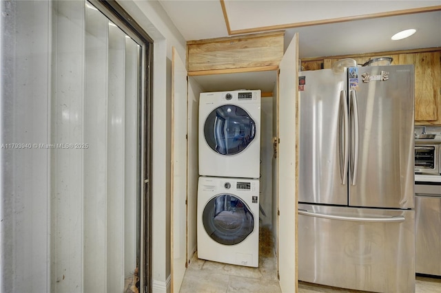 12079 W Regal Ct W, Wellington, FL 33414 - laundry room featuring estacked washer and dryer