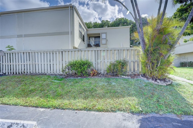12079 W Regal Ct W, Wellington, FL 33414 - view of property exterior featuring stucco siding