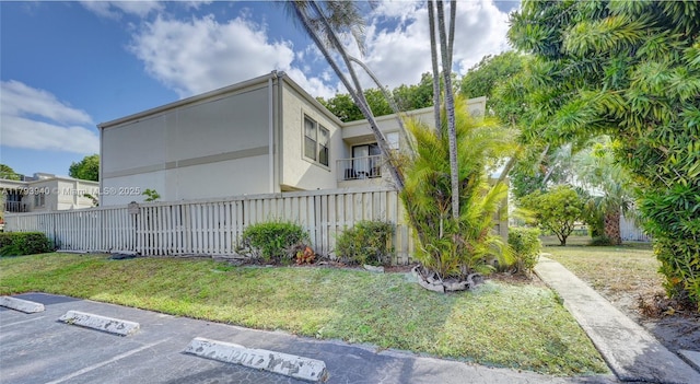 12079 W Regal Ct W, Wellington, FL 33414 - view of side of home featuring stucco siding