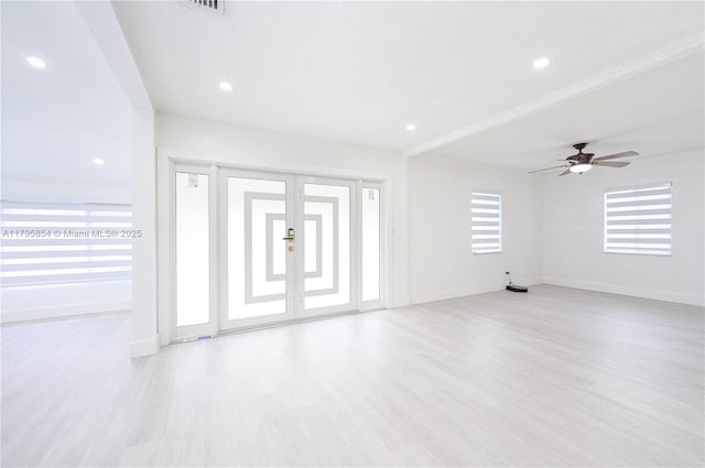 unfurnished living room featuring baseboards, ceiling fan, recessed lighting, and wood finished floors