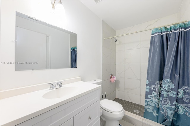 full bath with vanity, a stall shower, and toilet
