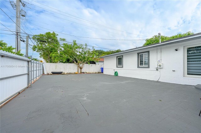 view of yard featuring a patio and a fenced backyard