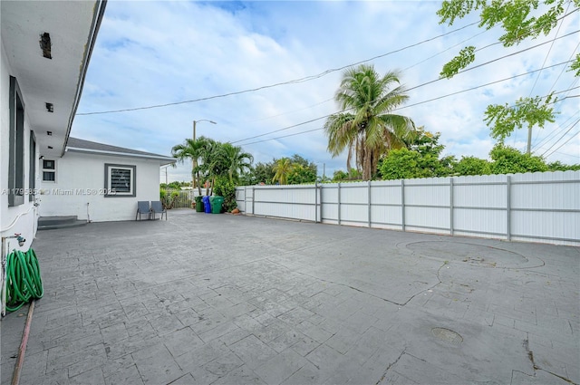 view of patio featuring fence
