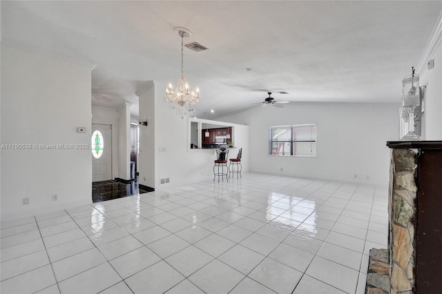 7618 NW 88th Cir, Tamarac, FL 33321 - unfurnished living room with a ceiling fan, lofted ceiling, light tile patterned flooring, and a chandelier