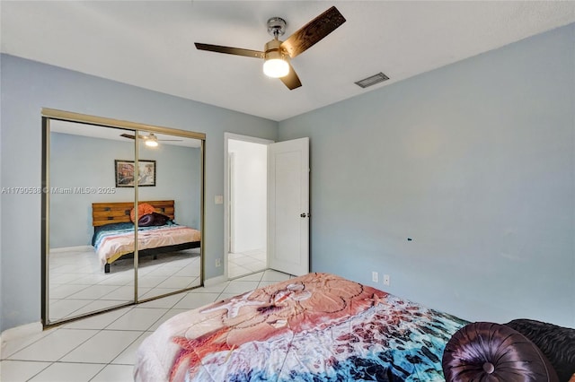 7618 NW 88th Cir, Tamarac, FL 33321 - bedroom with light tile patterned floors, a closet, ceiling fan, and baseboards
