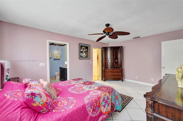 7618 NW 88th Cir, Tamarac, FL 33321 - bedroom with light tile patterned floors, ensuite bathroom, baseboards, and a ceiling fan