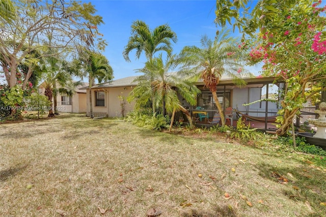 7618 NW 88th Cir, Tamarac, FL 33321 - view of grassy yard with a jacuzzi