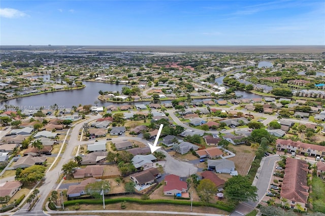 7618 NW 88th Cir, Tamarac, FL 33321 - aerial overview of property's location with nearby suburban area and a large body of water