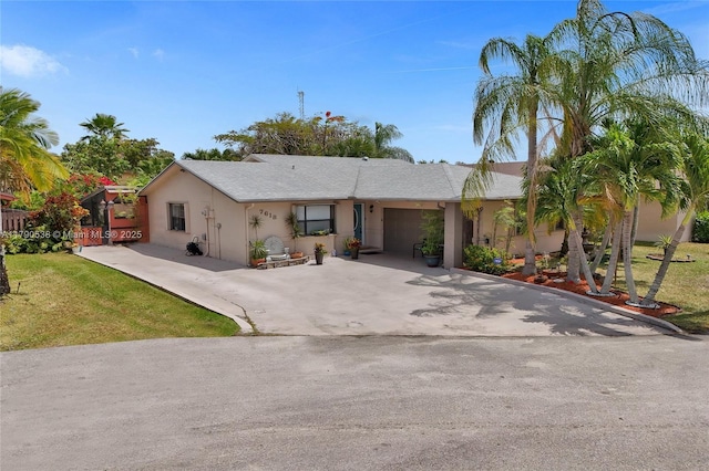 7618 NW 88th Cir, Tamarac, FL 33321 - single story home with a garage, driveway, stucco siding, and a front yard