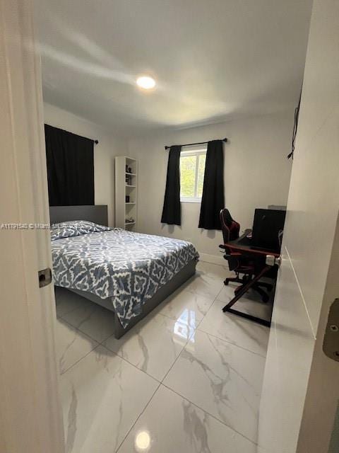 bedroom with marble finish floor