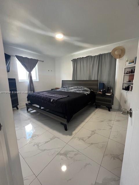 bedroom with marble finish floor