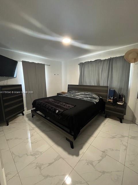 bedroom with marble finish floor
